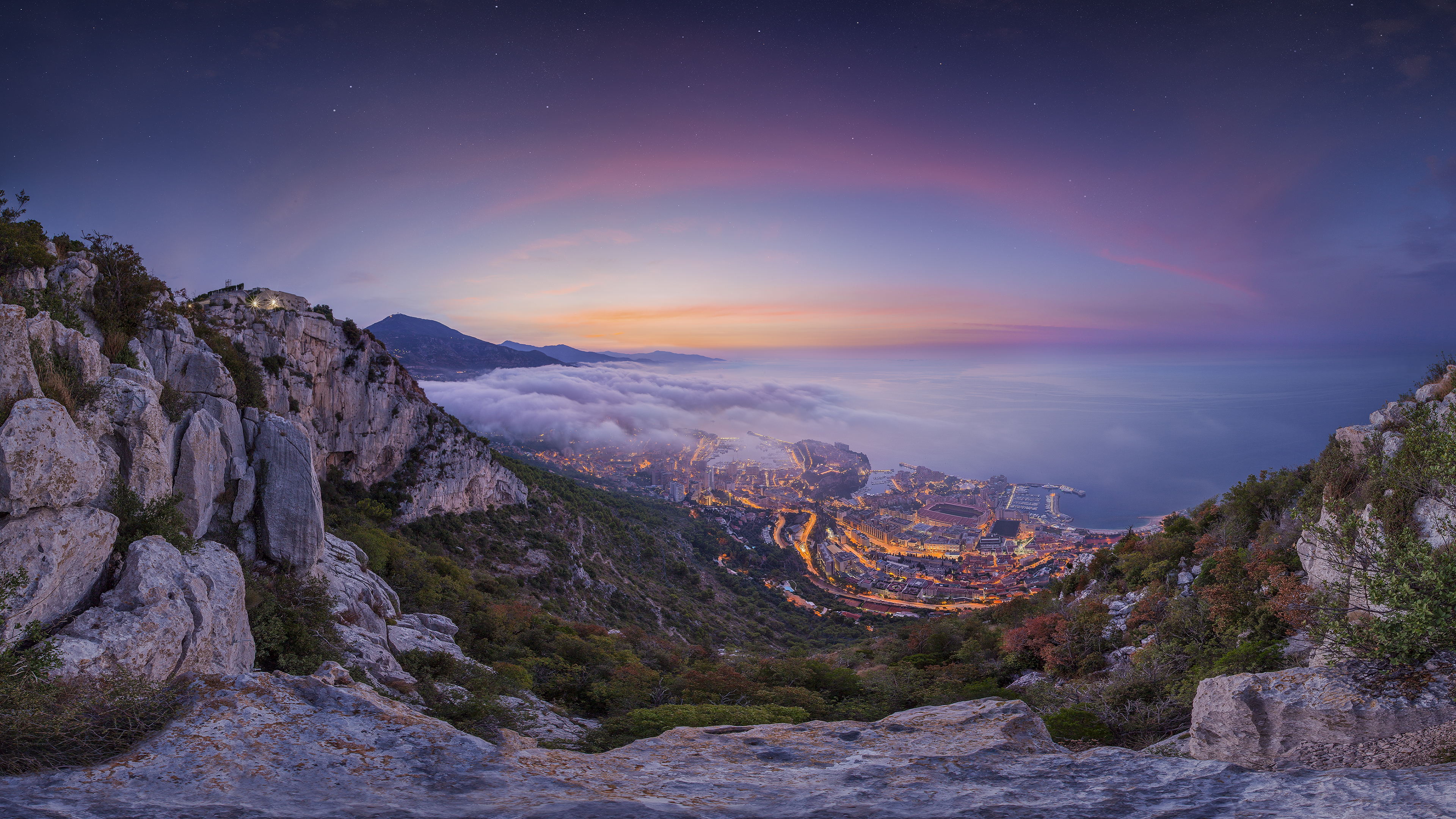 Sunrise twilight panorama with morning fog over the Principality of Monaco