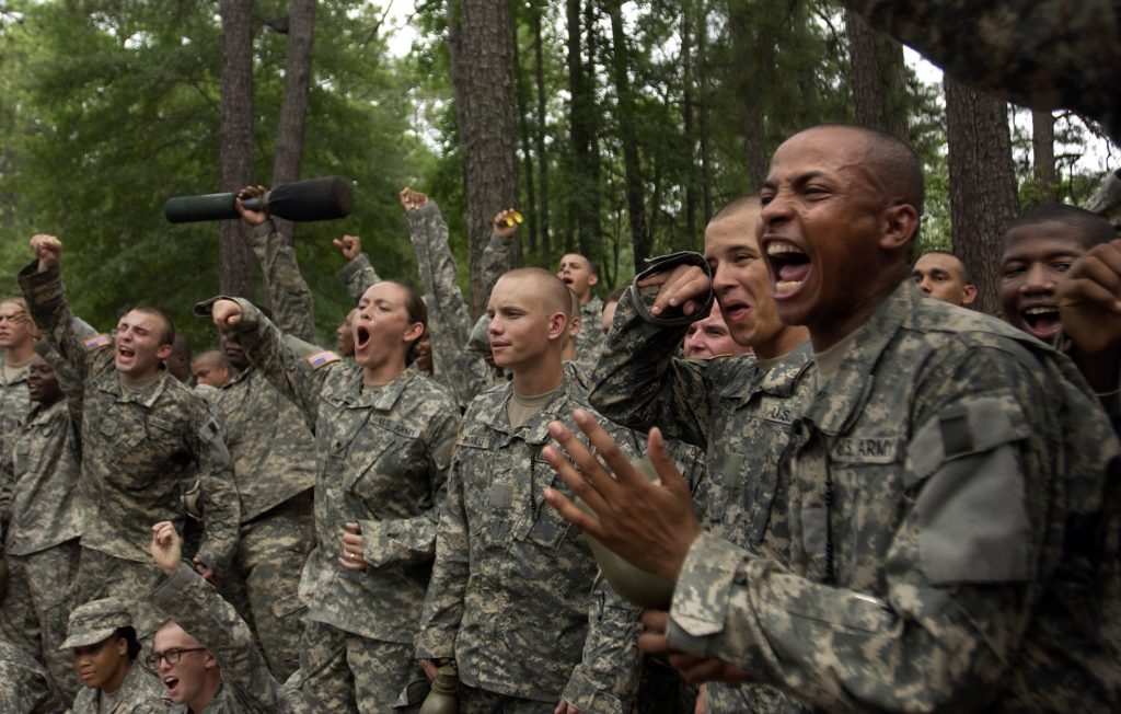 U.S. Army privates motivate their teammates as they compete in a hand-to-hand combat competition during Army basic training at Fort Jackson, S.C., Aug. 9, 2006. (U.S. Air Force photo by Senior Airman Desiree N. Palacios) (Released)